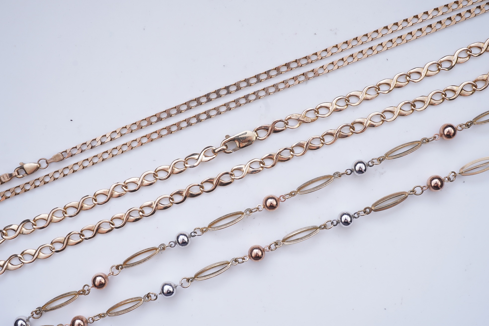 Three gold necklaces